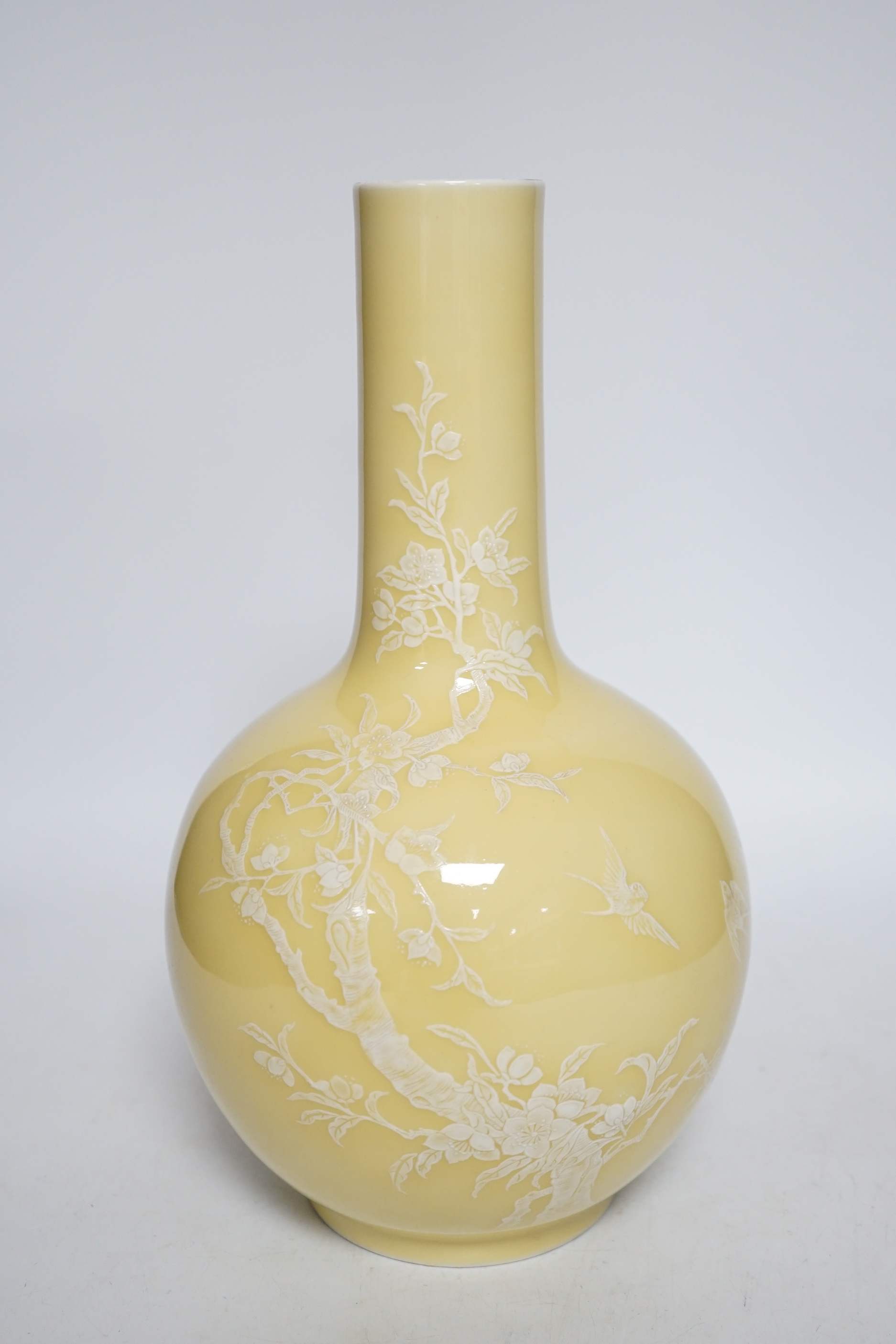 A Chinese yellow glazed bottle vase, drill hole to base, 29cm